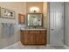 Bathroom with granite vanity and wood cabinets at 6809 Belmont Ct, Lakewood Ranch, FL 34202