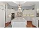 Spacious kitchen featuring white cabinets, quartz countertops, and stainless steel appliances at 6809 Belmont Ct, Lakewood Ranch, FL 34202