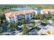 Lakefront building with ample parking and landscaping at 7702 Lake Vista Ct # 306, Lakewood Ranch, FL 34202