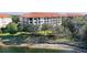 Aerial view of building and lakefront property at 7702 Lake Vista Ct # 306, Lakewood Ranch, FL 34202
