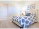Guest bedroom with a double bed and calming blue bedding at 7702 Lake Vista Ct # 306, Lakewood Ranch, FL 34202
