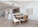 Spacious dining area with wood table and chairs at 7702 Lake Vista Ct # 306, Lakewood Ranch, FL 34202
