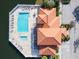 Aerial view of pool and clubhouse with lake access at 7702 Lake Vista Ct # 306, Lakewood Ranch, FL 34202