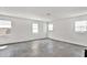 Expansive bonus room featuring gray tile flooring, neutral walls, and plenty of sunlight at 8035 Redonda Loop, Bradenton, FL 34202