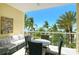 Relaxing balcony with stunning beach views and comfortable outdoor furniture at 915 Seaside Dr # 613 Weeks 4-5, Sarasota, FL 34242