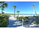 Sandy path lined with rope and wood posts winds through dunes towards the beach at 915 Seaside Dr # 613 Weeks 4-5, Sarasota, FL 34242