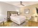 Cozy bedroom with wood floors, a comfortable bed, and a workspace at 915 Seaside Dr # 613 Weeks 4-5, Sarasota, FL 34242