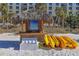 Tiki hut with yellow kayaks and other water sports equipment on the beach at 915 Seaside Dr # 613 Weeks 4-5, Sarasota, FL 34242