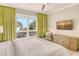 Spacious main bedroom with ocean views, king-size bed, and TV at 915 Seaside Dr # 613 Weeks 4-5, Sarasota, FL 34242