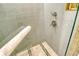 Glass-enclosed shower with mosaic tile, rainfall showerhead at 915 Seaside Dr # 613 Weeks 4-5, Sarasota, FL 34242