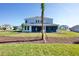 Home with fresh sod, mulch, and grass in back at 9153 Radiant Cir, Sarasota, FL 34241