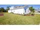 New construction home with fresh sod and small privacy bushes at 9153 Radiant Cir, Sarasota, FL 34241
