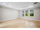 Spacious bedroom with a tray ceiling, recessed lighting and large windows at 9153 Radiant Cir, Sarasota, FL 34241