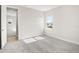 Bedroom with carpet flooring, an open doorway, and a bright window at 9153 Radiant Cir, Sarasota, FL 34241