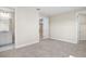 Carpeted bedroom with ensuite bathroom featuring a single sink vanity and walk-in closet at 9153 Radiant Cir, Sarasota, FL 34241