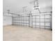 Two-car garage with concrete floor and white garage doors at 9153 Radiant Cir, Sarasota, FL 34241