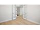 An open living space with wood floors and views of the staircase at 9153 Radiant Cir, Sarasota, FL 34241