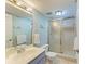 Updated bathroom with a walk-in shower and modern fixtures at 141 Wild Palm Dr, Bradenton, FL 34210