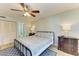 Bright bedroom featuring a comfortable queen-size bed and built-in shelving at 141 Wild Palm Dr, Bradenton, FL 34210