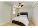 Cozy bedroom with full-size bed and plenty of natural light at 141 Wild Palm Dr, Bradenton, FL 34210