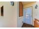 Front entrance with wood-paneled accent wall and white door at 141 Wild Palm Dr, Bradenton, FL 34210