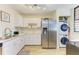 Modern kitchen with stainless steel appliances and white cabinets at 141 Wild Palm Dr, Bradenton, FL 34210