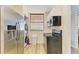 Updated kitchen with stainless steel appliances and white cabinets at 141 Wild Palm Dr, Bradenton, FL 34210