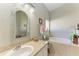 Bathroom features a large soaking tub and updated vanity at 1605 21St W Ave, Palmetto, FL 34221