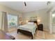 Bright bedroom with a comfortable bed and ample natural light at 1605 21St W Ave, Palmetto, FL 34221