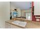 Kitchen features a double sink, dishwasher, and breakfast bar at 1605 21St W Ave, Palmetto, FL 34221
