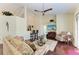 Living room with hardwood floors, comfortable seating, and a flat-screen TV at 1605 21St W Ave, Palmetto, FL 34221