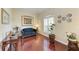 Relaxing sitting area with hardwood floors, a dark blue couch, and large windows at 1605 21St W Ave, Palmetto, FL 34221