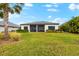 House exterior and backyard with green grass at 17714 Waterville Pl, Bradenton, FL 34202