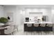 Modern kitchen with marble island and dining area at 18040 Quincy Ave, Port Charlotte, FL 33948