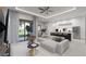 Open living room with white sofa and access to backyard at 18040 Quincy Ave, Port Charlotte, FL 33948