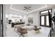 Open living room with white sofa and kitchen view at 18040 Quincy Ave, Port Charlotte, FL 33948