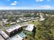 A beautiful aerial view of the condo community with a swimming pool and ocean views in the distance at 207 Rubens Dr # D, Nokomis, FL 34275