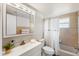 Bathroom with a shower-tub combination, well-lit vanity with a large mirror and a neutral color palette at 207 Rubens Dr # D, Nokomis, FL 34275