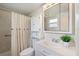 Bright bathroom with vanity, shower, and toilet at 207 Rubens Dr # D, Nokomis, FL 34275