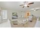 Open living space showcasing tile floors, a TV, and access to a dining area at 207 Rubens Dr # D, Nokomis, FL 34275