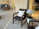 Inviting patio with cozy wicker furniture and tiled floors, perfect for outdoor relaxation at 207 Rubens Dr # D, Nokomis, FL 34275