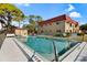 Inviting community pool with surrounding patio at 207 Rubens Dr # D, Nokomis, FL 34275