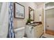 Bathroom with granite countertop, updated vanity, and shower/tub combo at 2127 Lusitania Dr, Sarasota, FL 34231