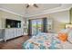 Bedroom with a large bed, water view, and access to a private balcony at 2127 Lusitania Dr, Sarasota, FL 34231