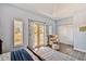 Serene bedroom with private balcony access and comfortable sitting area at 2127 Lusitania Dr, Sarasota, FL 34231
