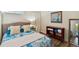 Cozy bedroom with a comfortable bed and plenty of storage at 2127 Lusitania Dr, Sarasota, FL 34231