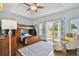 Charming bedroom featuring a bunk bed, private balcony, and relaxing seating area at 2127 Lusitania Dr, Sarasota, FL 34231