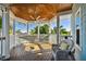 Relaxing covered porch with hammock and rocking chair, offering scenic views at 2127 Lusitania Dr, Sarasota, FL 34231