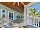 Peaceful covered porch with a hammock for lounging and enjoying the outdoors at 2127 Lusitania Dr, Sarasota, FL 34231