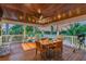 Spacious deck with dining area and comfortable seating, offering beautiful water views at 2127 Lusitania Dr, Sarasota, FL 34231